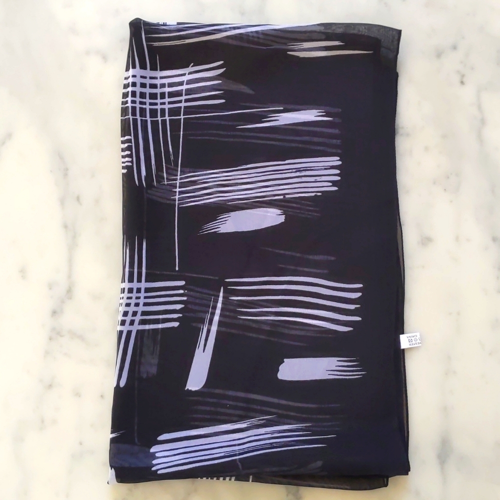 NWOT. Black and White Multi Pattern Scarf.